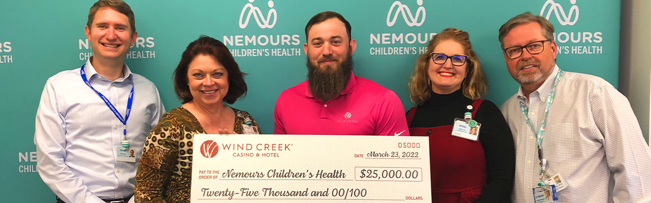 $25,000 check being presented to Nemours Children's Health