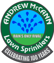 Logo of Andrew Mccann Lawn Sprinklers, featuring a blue spray pattern and their slogan "Rain's Only Rival", celebrating 100 years, set against a green circular background.