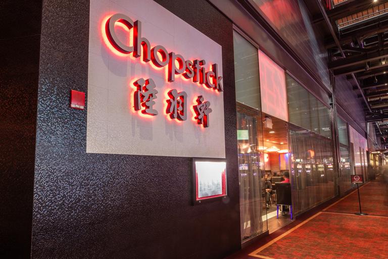 The Chopstick restaurant logo next to the restaurant entrance