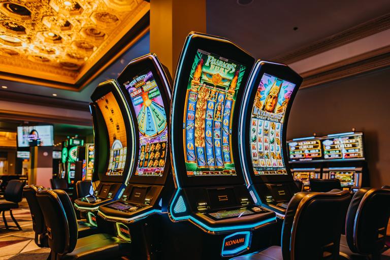 Several slot machines with curved screens