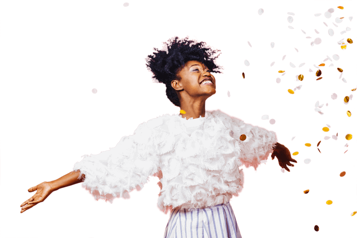 smiling woman throwing confetti