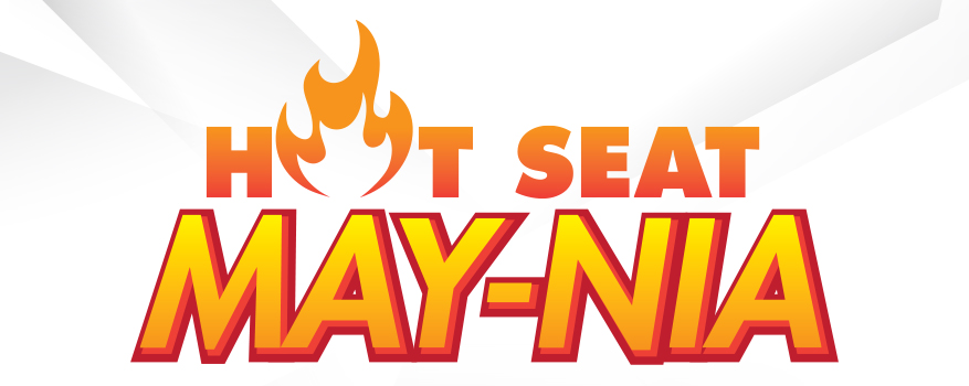 Logo of "hot seat may-nia" featuring bold, fiery text to emphasize excitement and intensity, set against a simple white background with abstract shapes.