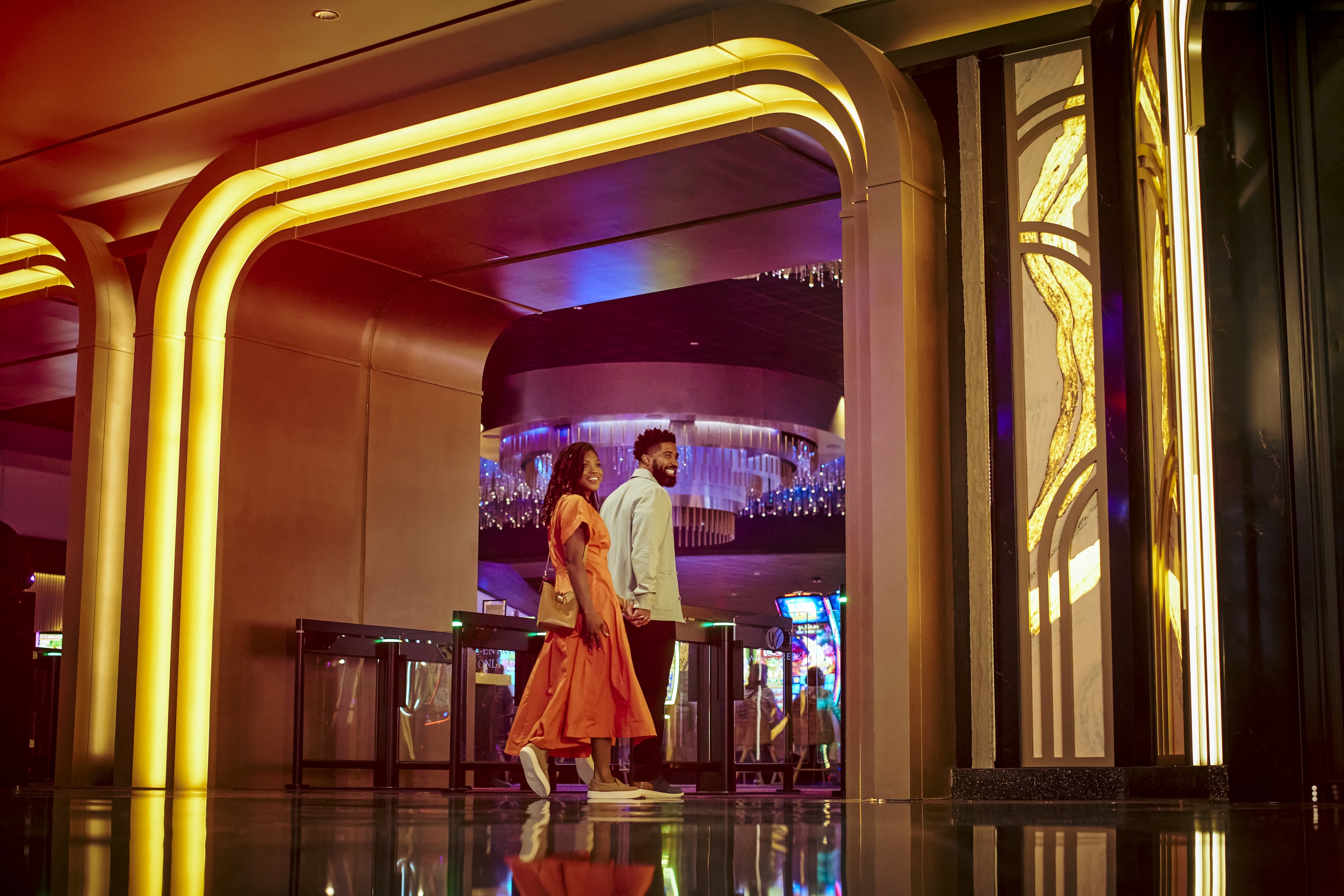 A couple walking through Wind Creek Chicago Southland