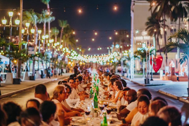 Diners enjoying their meal at the Aruba Long Table event