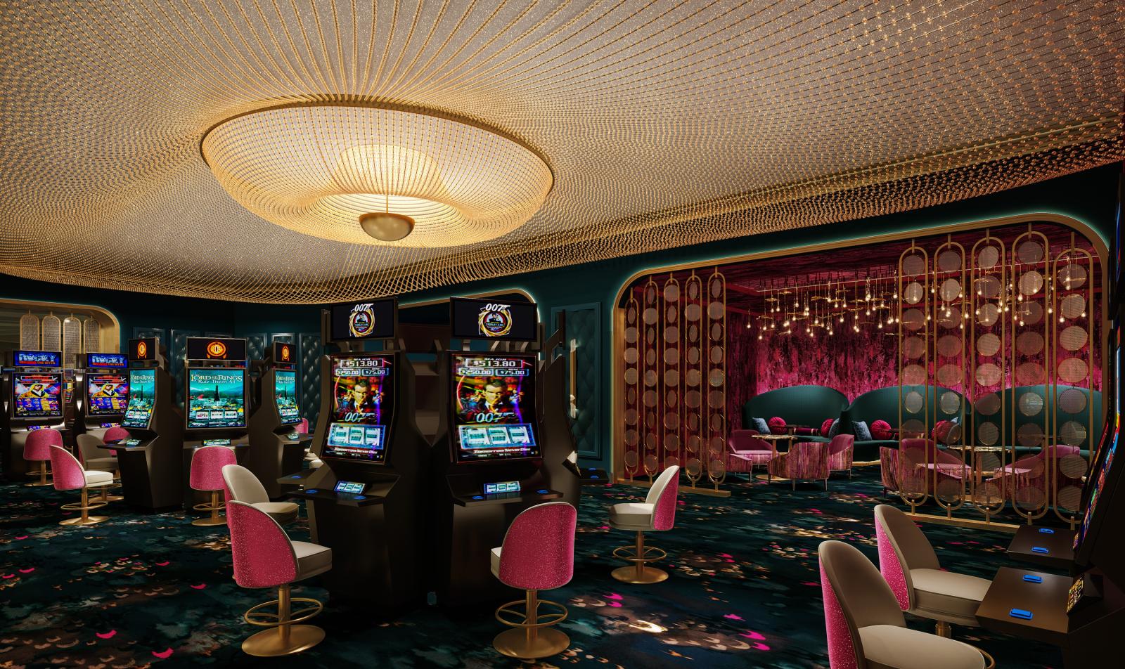 An intamite area of the casino floor with a secluded lounge decorated in gold, teal. and magenta