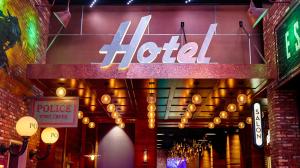 A view of the hallway and Hotel sign at Wind Creek Montgomery