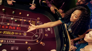 woman throwing dice at craps table