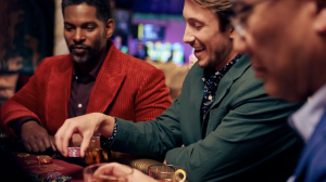 three men playing poker at wind creek chicago southland