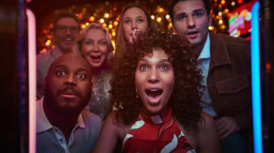Group of people gaming on a slot machine